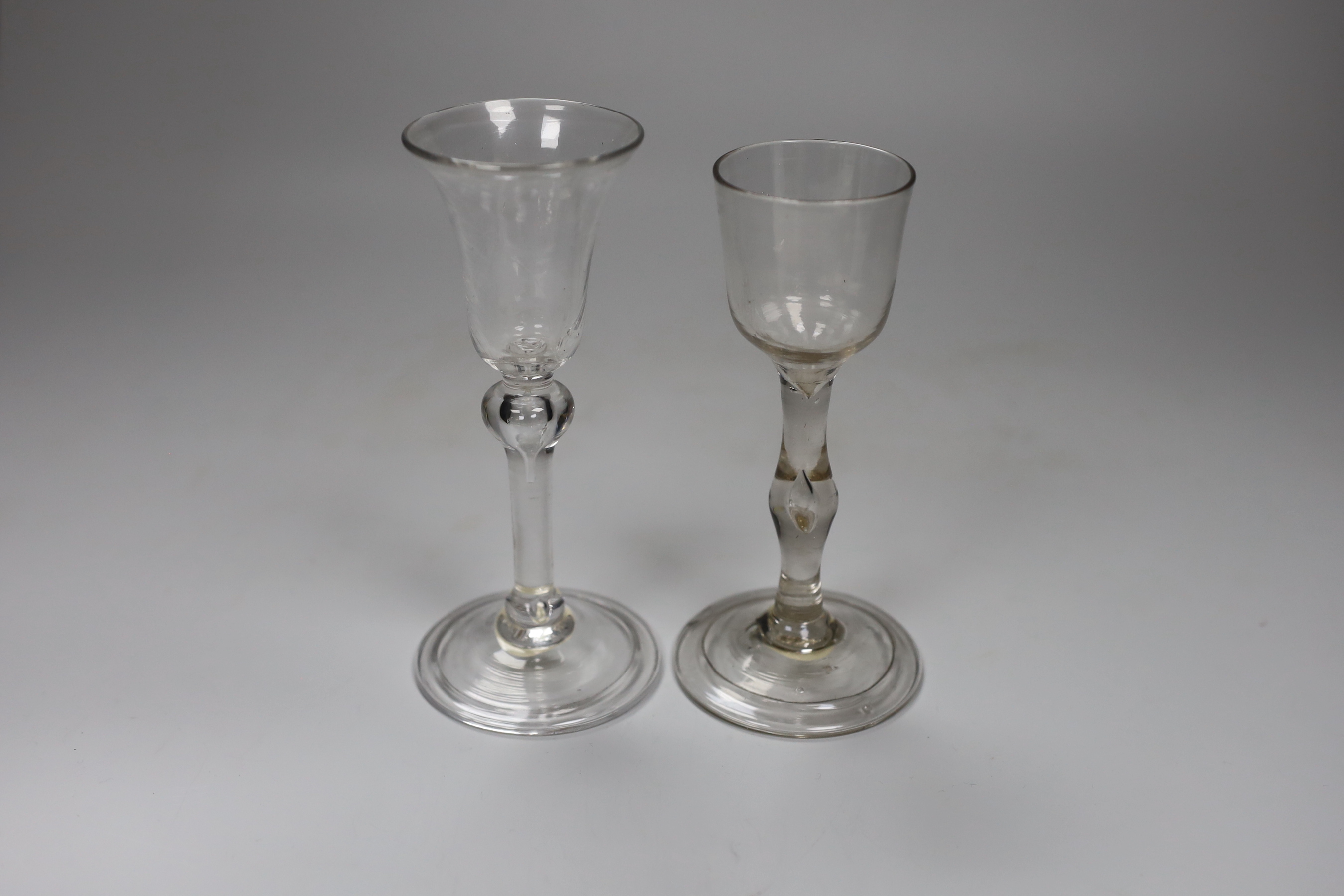 Two George II wine glasses, each with folded foot, tallest 15.5cm